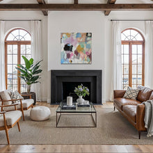Load image into Gallery viewer, Living room with wooden beams, large windows, and modern decor.
